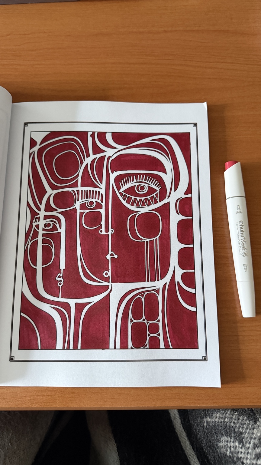 Abstract geometric artwork colored in deep crimson